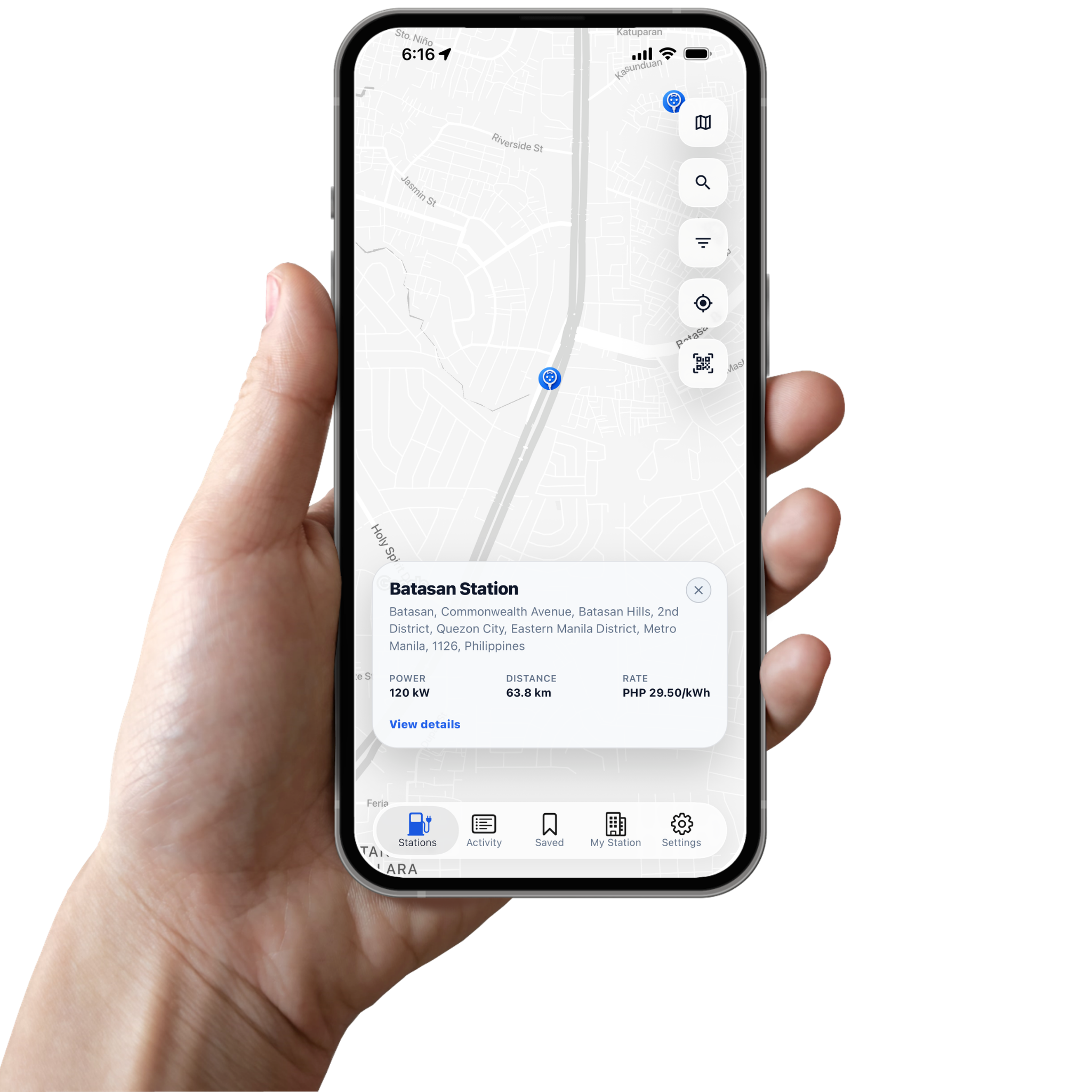 A hand holding the Evhubi mobile app on a station map